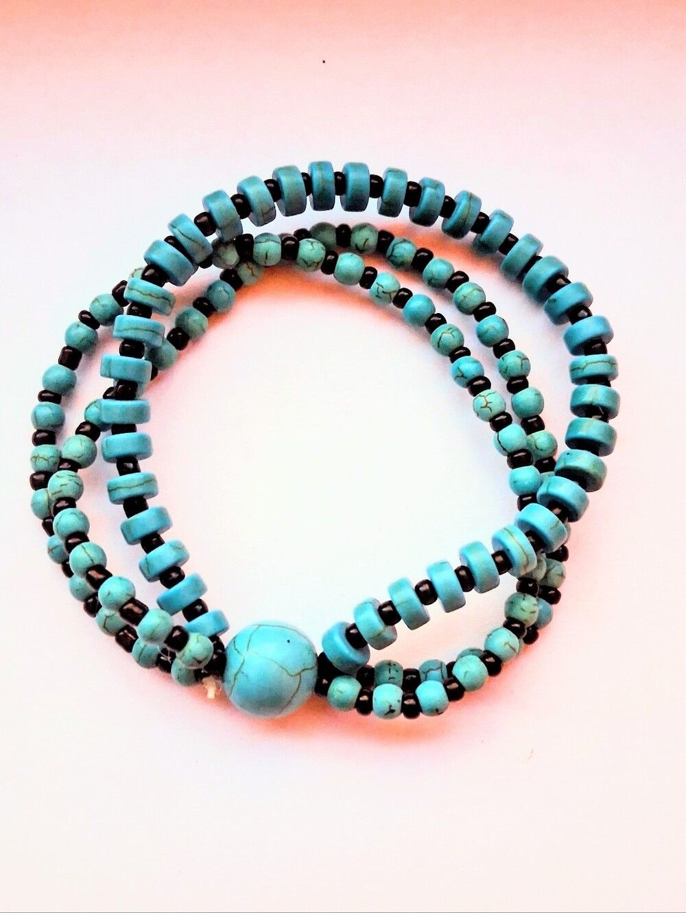 Multi-Strand Turquoise Colored Heishi Bead Bracelet with Center Focal Stone